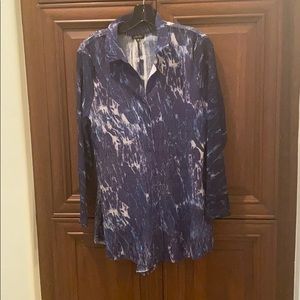 A Komarov blouse with a fitted frame and tie back